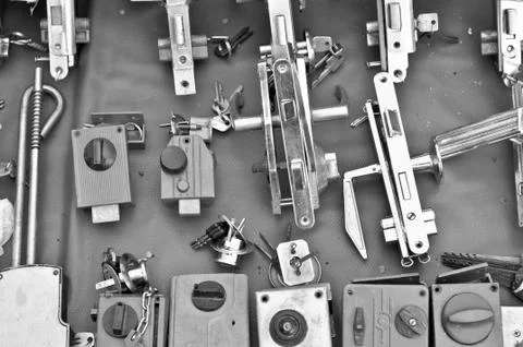 Many Old door locks on open-air bazaar BW Stock Photos