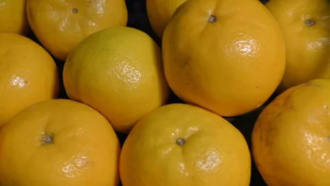 Many oranges moving in the circle and stacked Stock Footage 128200065