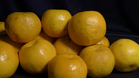 Many oranges moving in the circle and stacked Stock Footage 128200166