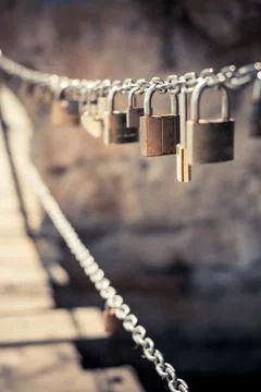 Many padlocks on a chain Stock Photos