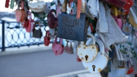 Many padlocks hanging on bridge Video stock 77137829