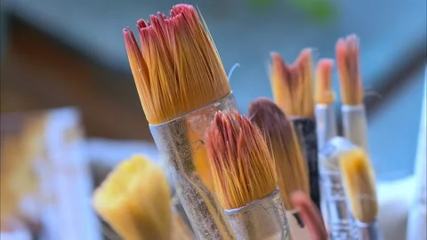 Many paint brushes in a jar. Creative hobby. Stock Footage 291511197