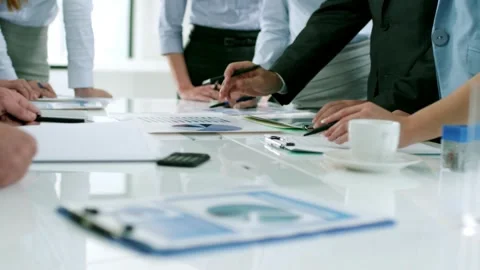 Many paper sheets with chart, data, report, sticky notes, and notebook about  Stock Footage 256743246