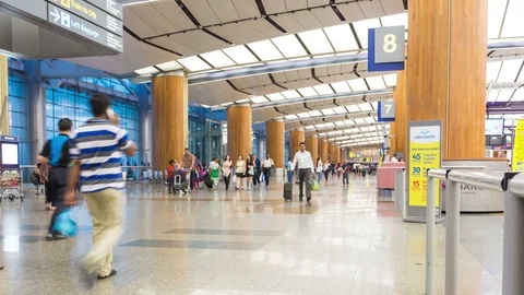 Many passenger walking in front of check-in counter Stock Footage 91975617