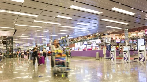 Many passenger walking in front of check-in counter Stock Footage 91977602