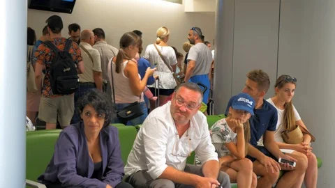 Many Passengers Standing In Queue at the Airport Stock Footage 96988491