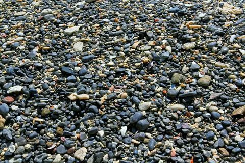 Many pattern and textured of small black gravel and white pebble on the tropi Stock Photos