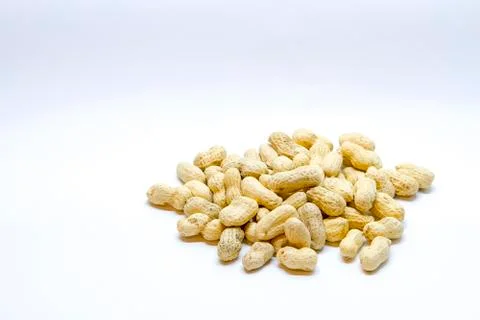 Many peanuts in the shell on a white background Stock Photos