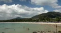Many people on a beach, Main destination for the growing tourism industry HD Footage