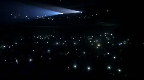 Many people in opera shine flashlights Stock Footage 60119386