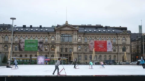 Many people skating on a big square at a historic building in Helsinki in winter Stock Footage 122820109