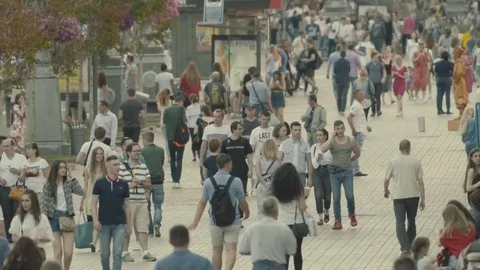 Many people walk down the street. Crowded street. Crowd. Slow motion. Stock Footage