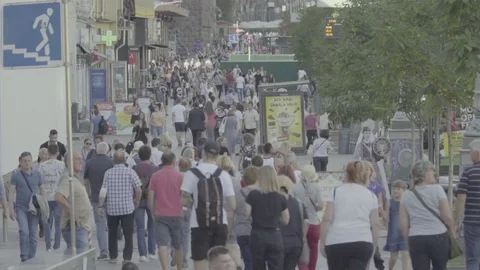 Many people walk down the street. Crowded street. Crowd. Slow motion. Stock Footage