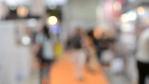 Many people walk inside the mall exhibition store Stock Footage 80320330