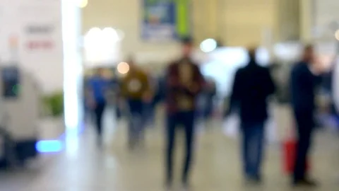 Many people walk inside the mall exhibition store. Stock Footage 82741692