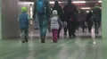 Many people walking through underground passage at airport or railway station HD Footage