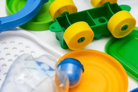 Many pet plastic objects, things bottles toys caps that can be recycled in order Stock Photos