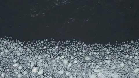 Many pieces of ice interact with each other while swaying on the waves. Stock Footage 225311813