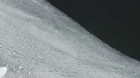 Many pieces of ice interact with each other while swaying on the waves. Stock Footage 225315160