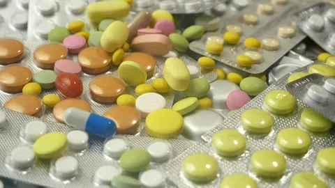 Many pills in blister pack, rotating, Stock Footage 304860281