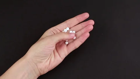 Many pills in the hand Stock Footage 82272159