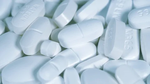 Many pills at a pharmaceutical factory table. Drug prescription. Stockbeeldmateriaal 110826537