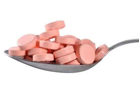 Many pills in spoon Stock Photos
