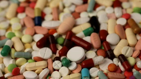 Many pills turning Stock Footage