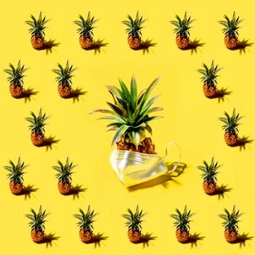 Many pineapples on a solid yellow background pattern Stock Photos