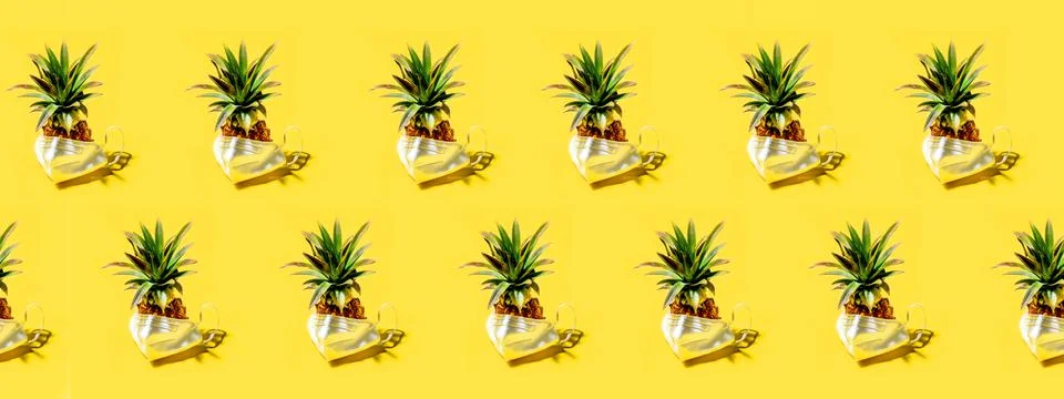 Many pineapples on a solid yellow background pattern Stock Photos