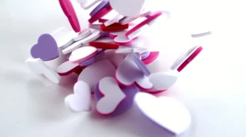 Many pink heart confetti dropping on the floor Stock Footage