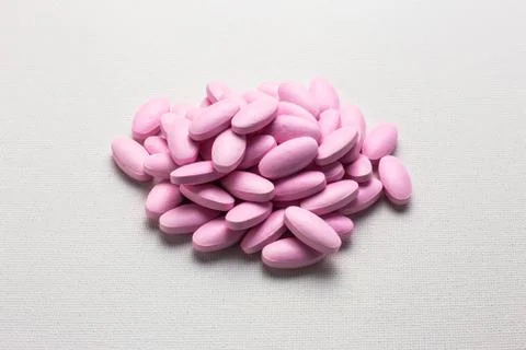 Many pink tablets pills Stock Photos