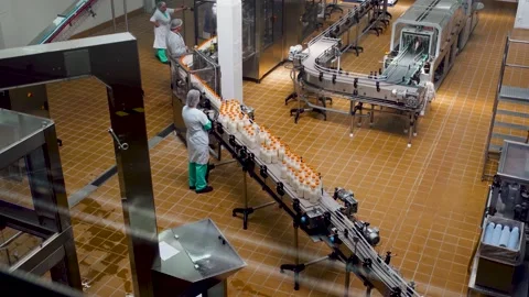 Many plastic bottles move on an automated conveyor belt. Stock Footage 138521077