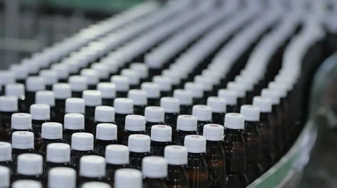 Many Plastic Bottles Moving on Conveyor Video stock 64953878