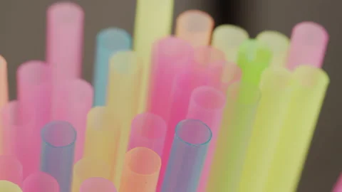 Many plastic multicolored cocktail tubes, close-up, camera movement, rack focus Stock Footage 141384672