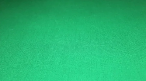 Many poker chips falling on green casino table Stock Footage 64837395