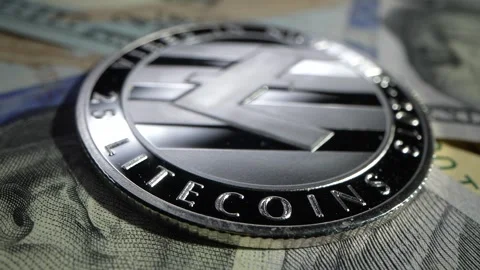 Many popular cryptocoins lay on the black table. Gold Litecoin. ZCASH ZEC and Stock Footage 271028004