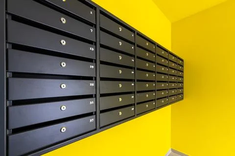 Many post boxes in modern apartment building. Postage boxes in an apartment.. Stock Photos