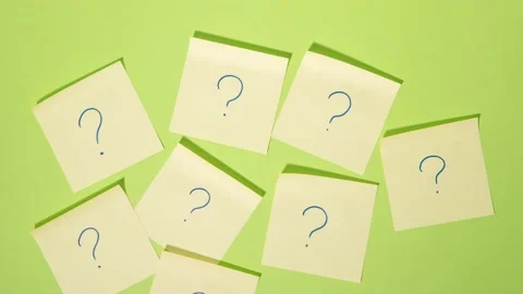 Many Questions on a green background - Stop Motion Animation - Note Paper Stock Footage 139278216
