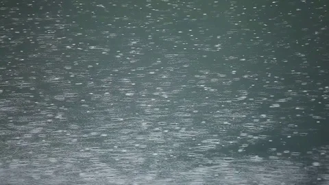 Many Rain drops on the lake Surface Stockbeeldmateriaal 84332803