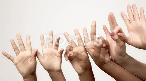 Many raised children's expressive hands in a row. Stock Photos