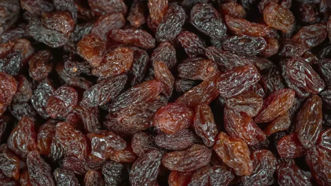 Many raisins at rotating background - looping video Stock Footage 168936621