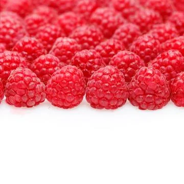 Many raspberry berries isolated on white Stock Photos
