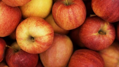 Many red apple closeup rotating on a 4K background in store for buyer. Stock Footage 116784972