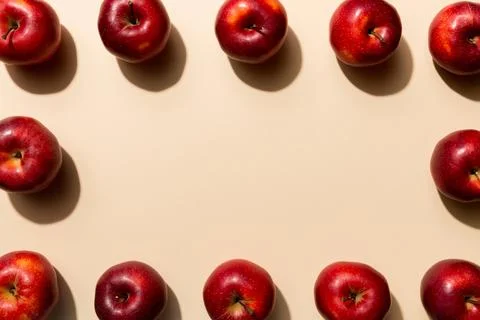 Many red apples on colored background, top view. Autumn pattern with fresh .. Stock Photos