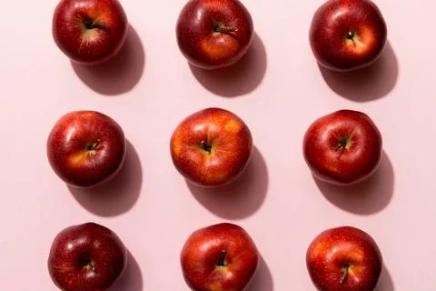Many red apples on colored background, top view. Autumn pattern with fresh .. Stock Photos
