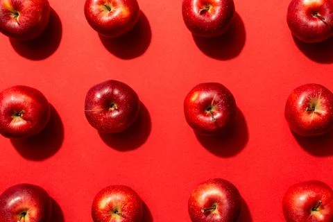 Many red apples on colored background, top view. Autumn pattern with fresh .. Stock Photos