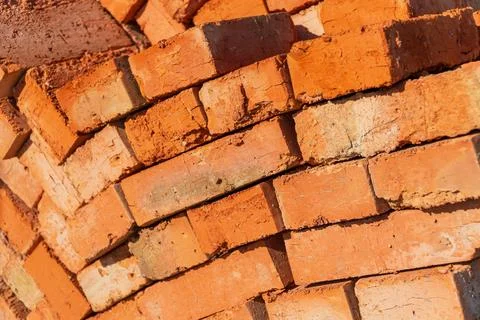 Many red bricks. The bricks is used in construction. Bricks material. Stockfoto's