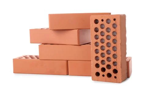 Many red bricks on white background. Building material Stock Photos