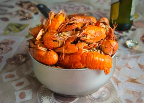 Many red cooked appetizing crayfish in the scoop on the table Stock Photos